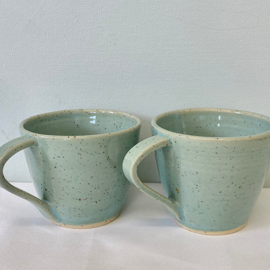 004. Pair of Robin-egg blue speckled cups